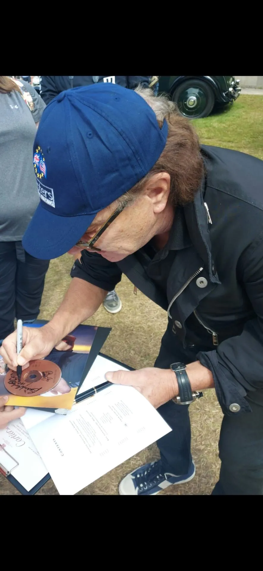 Celebrity signing memorabilia at an event