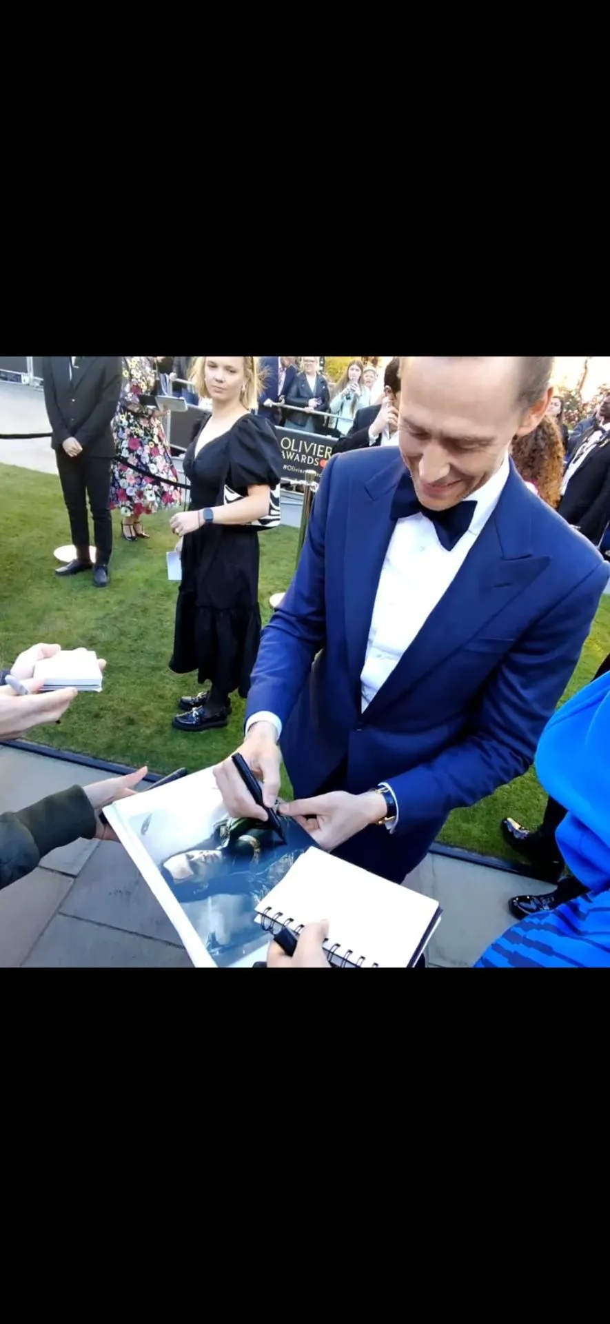 Tom Hiddleston signing at the Olivier Awards