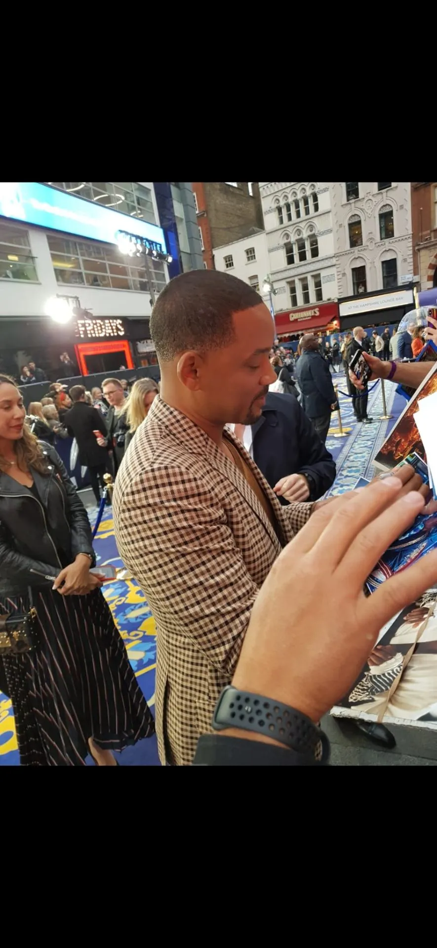 Celebrity signing at a premiere