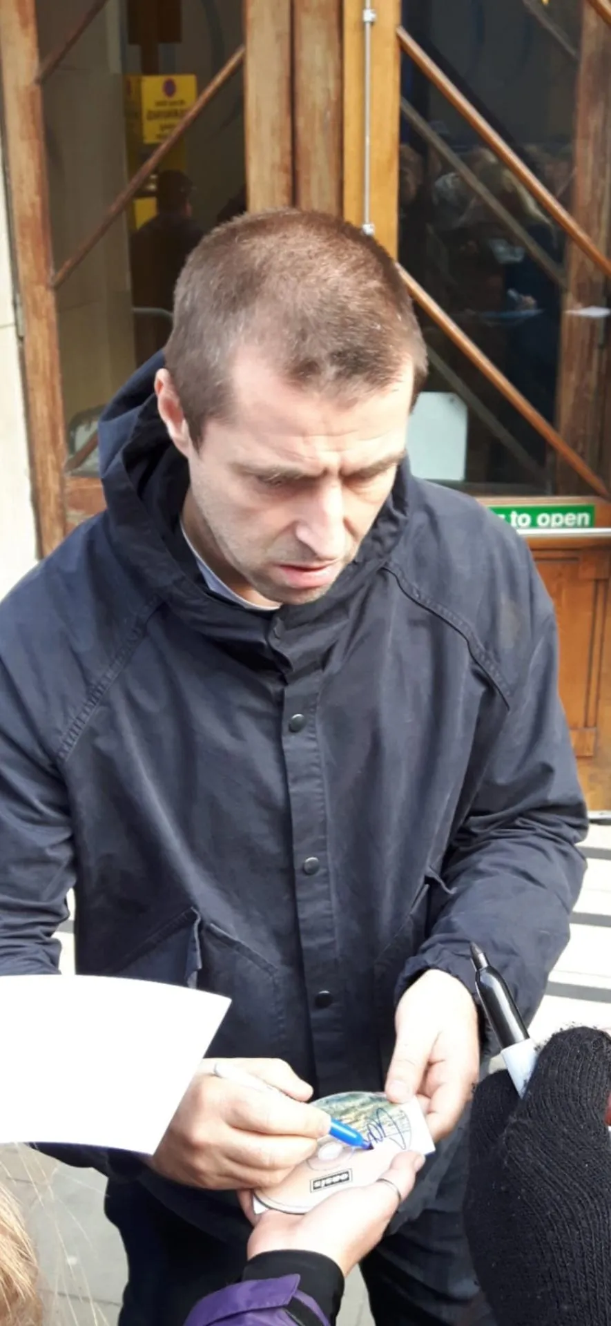 Musician signing memorabilia
